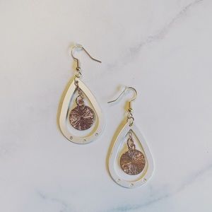 White metal and gold earrings